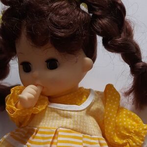 Doll wearing a yellow dress with Brown Hair